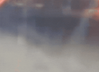 a blurred image of a person standing on a beach