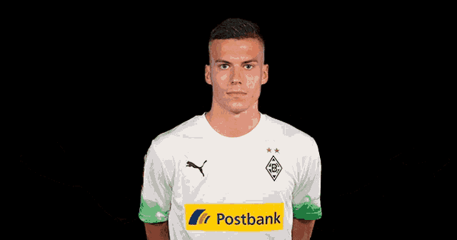 a man wearing a white shirt with a postbank logo