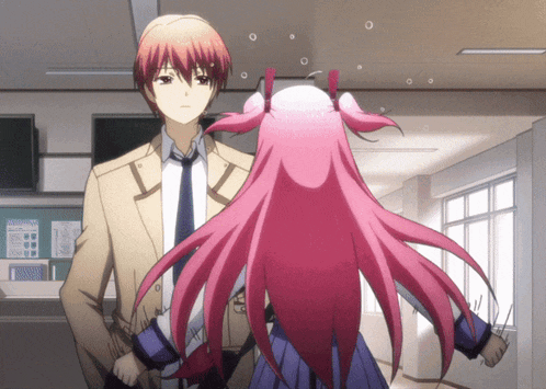 a man and a girl are standing next to each other
