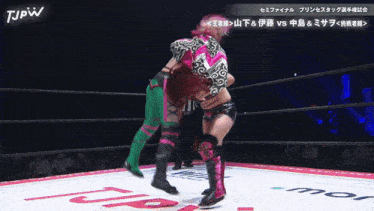 two women wrestling in a ring with tjpw written on the bottom of the screen