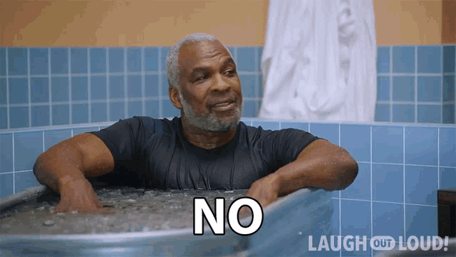 a man in a bathtub with the word no written on it