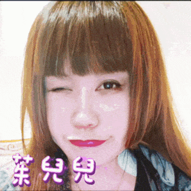 a girl with chinese writing on her face winks