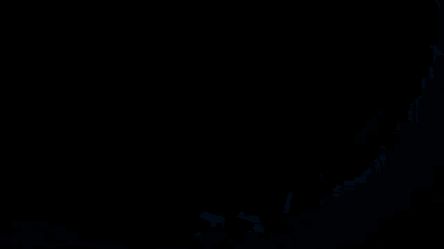 a dark room with a blue light coming through a hole in the wall