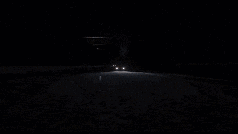 a car is going through a tunnel at night