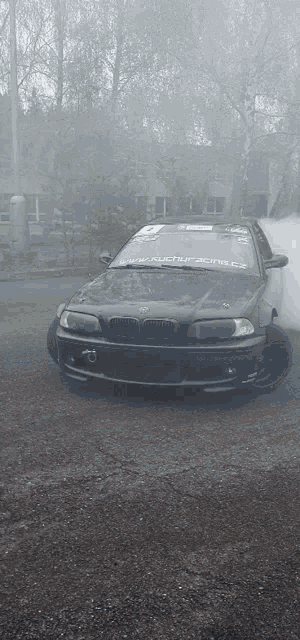 a black car with a sticker on the windshield that says bmw motorsports