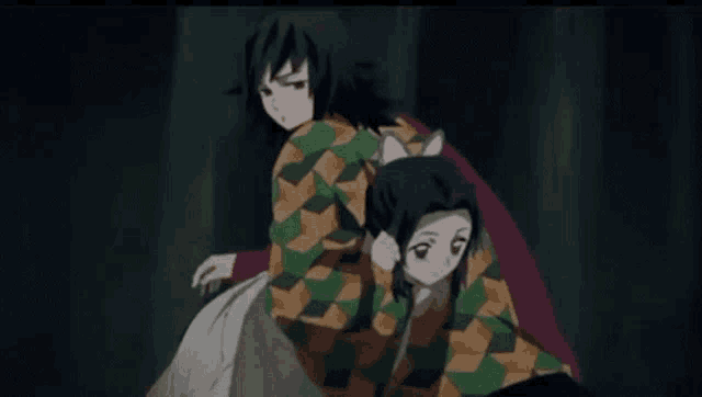 a man and a woman are dancing together in a dark room .