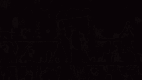 a group of people are standing in a dark room with smoke coming out of them and the word th on the bottom right