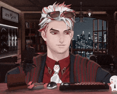 a man wearing sunglasses and a red shirt is sitting at a desk with a keyboard