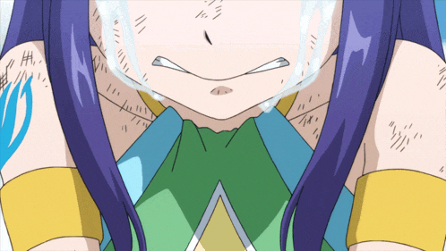 a close up of a girl 's face with tears coming out of her eyes
