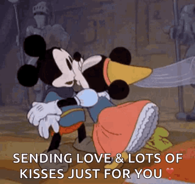 a cartoon of mickey mouse and minnie mouse kissing with the caption sending love and lots of kisses just for you