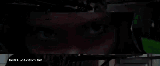 a close up of a man holding a rifle with the words sniper assassin 's end on the bottom