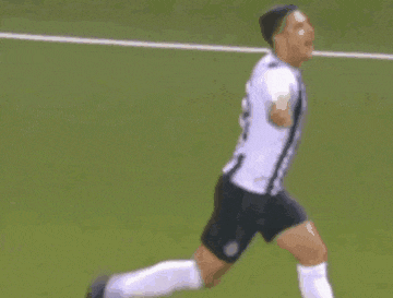 two men are playing soccer on a field and one of them is wearing a number 1 jersey .