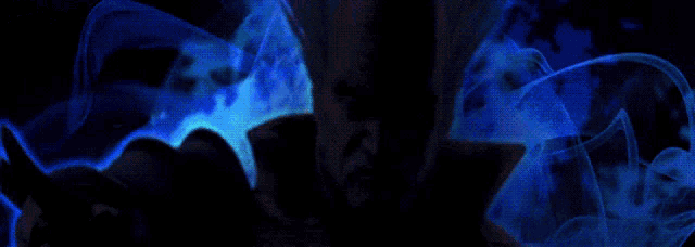 a close up of a man holding a sword with smoke behind him