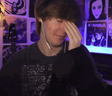 a man wearing headphones and a t-shirt that says a on it