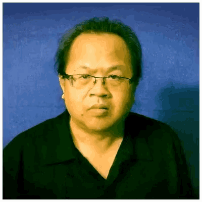 a man with glasses is wearing a black shirt