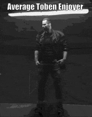a black and white photo of a muscular man with the caption average toben enjoyer .