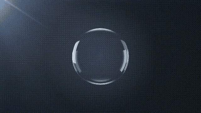 a sphere of water is splashing on a dark background