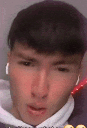 a close up of a man 's face with a smiley face on the bottom