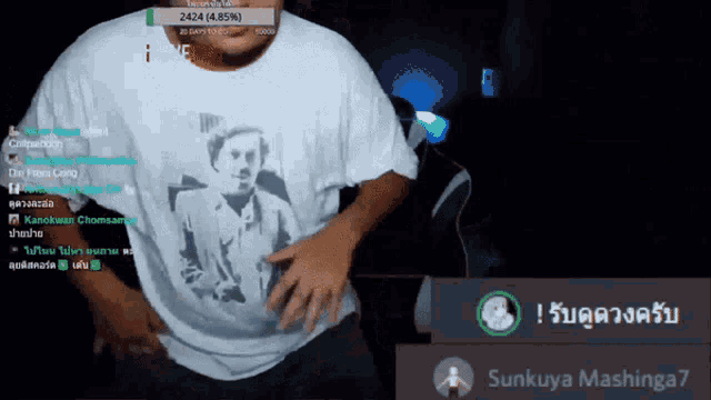 a man wearing a shirt with a picture of charlie chaplin