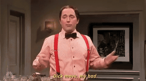 a man in a pink shirt and red suspenders is standing in front of a table and saying `` dick move , my bad '' .