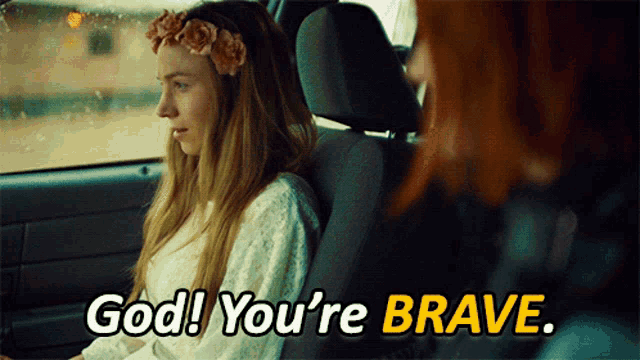 a woman sitting in a car with the words god you 're brave