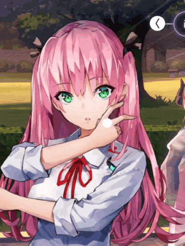 a girl with pink hair and green eyes is pointing to her face