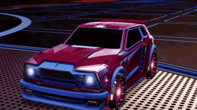 a red and blue car is sitting on a metal surface in a video game .