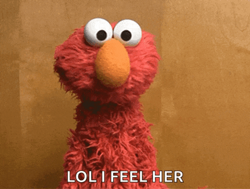 elmo from sesame street says " loli feel her " in front of a brown background
