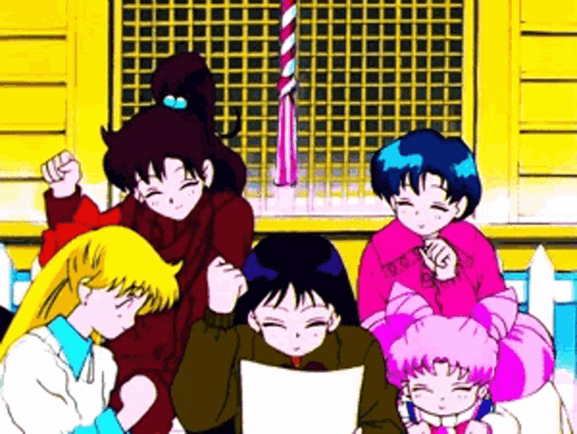 a group of anime characters are standing in front of a yellow building .