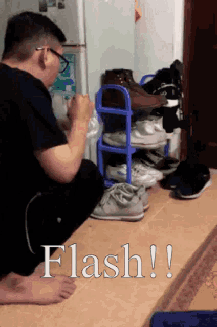 a man is kneeling down in front of a shoe rack with the word flash written on the floor