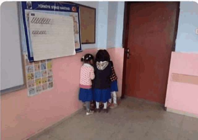 a group of children standing in front of a whiteboard that says ' turkey ' on it