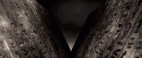 a dark tunnel with a lot of letters on it