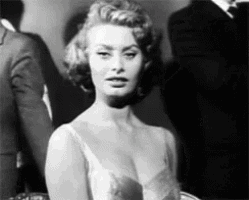 a black and white photo of a woman with a very large breast