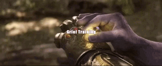 a close up of a person 's hands holding a glowing object with the words gatel training written on the bottom .