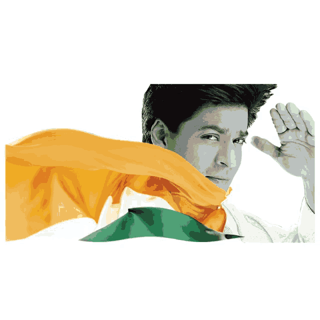 a man covering his face with a yellow orange and green scarf