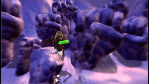 a man in a green shirt stands in front of a monster