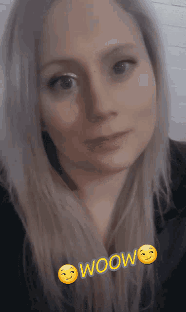 a close up of a woman 's face with the words woow written on it