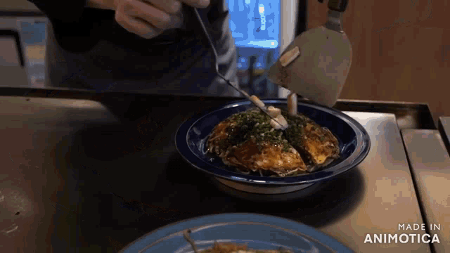 a plate of food with the words made in animotica on the bottom right