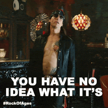 a man without a shirt stands in front of a sign that says you have no idea what it 's