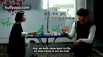 a man and a woman are sitting at a table with a caption that says hey we both came back to life