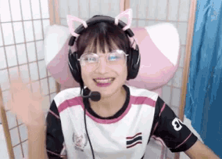 a girl wearing headphones and a shirt with the number 9 on the arm