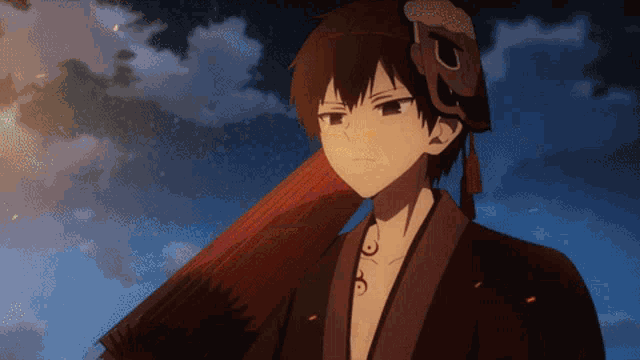 a person with a mask on their head and a red umbrella
