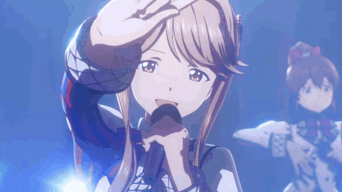 a girl is singing into a microphone while another girl looks on