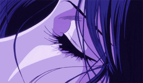a close up of a woman 's eye with long lashes