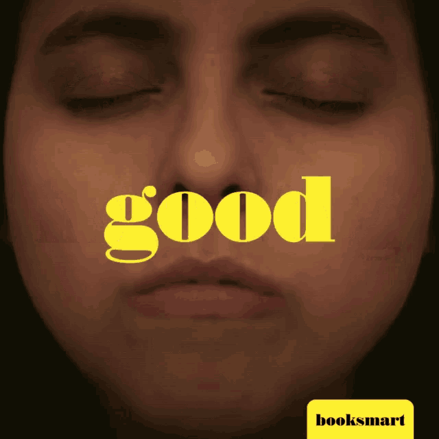 a close up of a woman 's face with the word good written above it