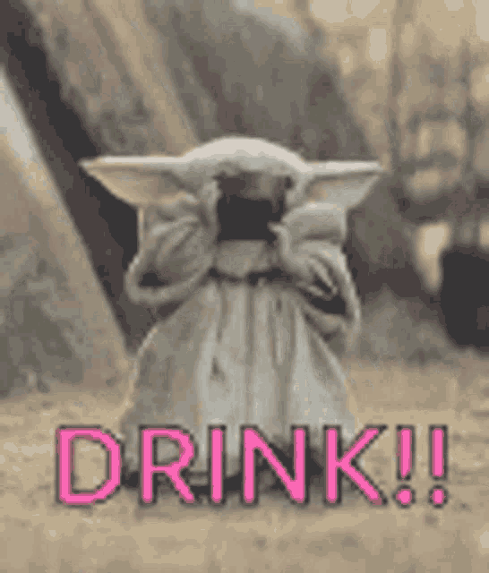 a baby yoda is sitting in the dirt with the words `` drink !! '' written in pink .