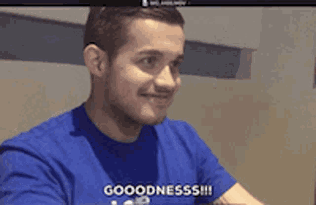 a man wearing a blue shirt says goodness !!!