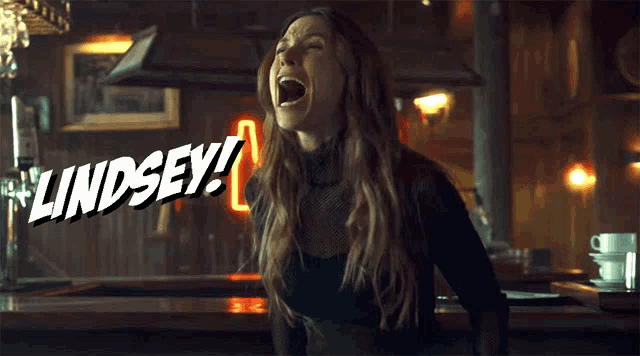 a woman is screaming with the word lindsey behind her