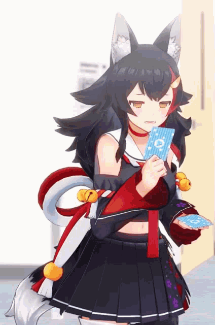 a girl with a fox tail is holding a card that says o