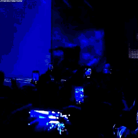 a wrestler is walking down a ramp with the words " i am phenomenal " on the screen behind him